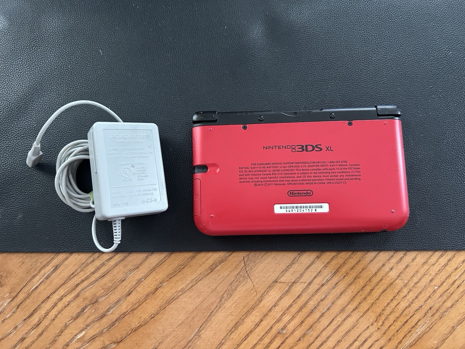 Nintendo 3DS XL Red/Black Console w/ AC Adapter + Pokémon Sun Game NTSC-U/C