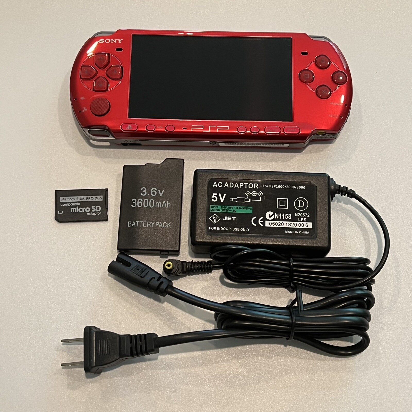 RADIANT RED PSP 3000 System w/ 8gb Memory Card, Charger, & Battery Bundle Import
