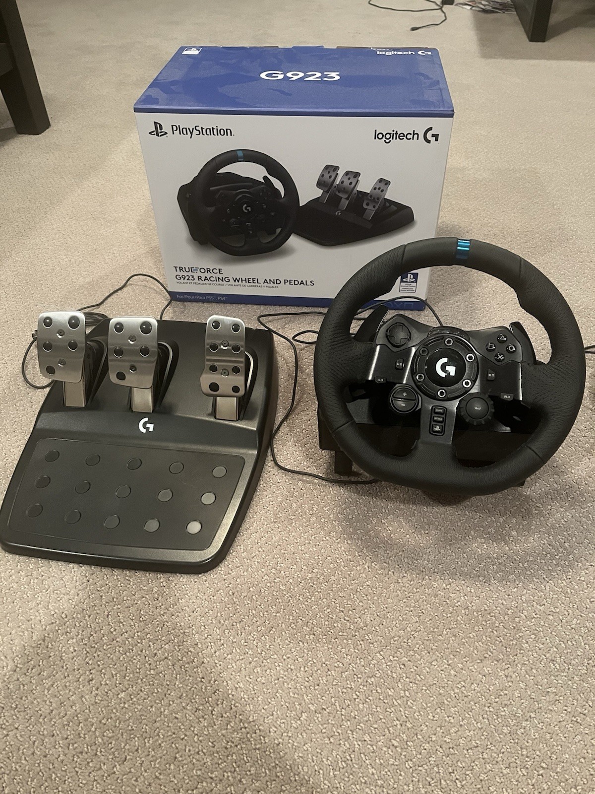 Logitech G923 Racing Wheel with Pedals, feels brand new.