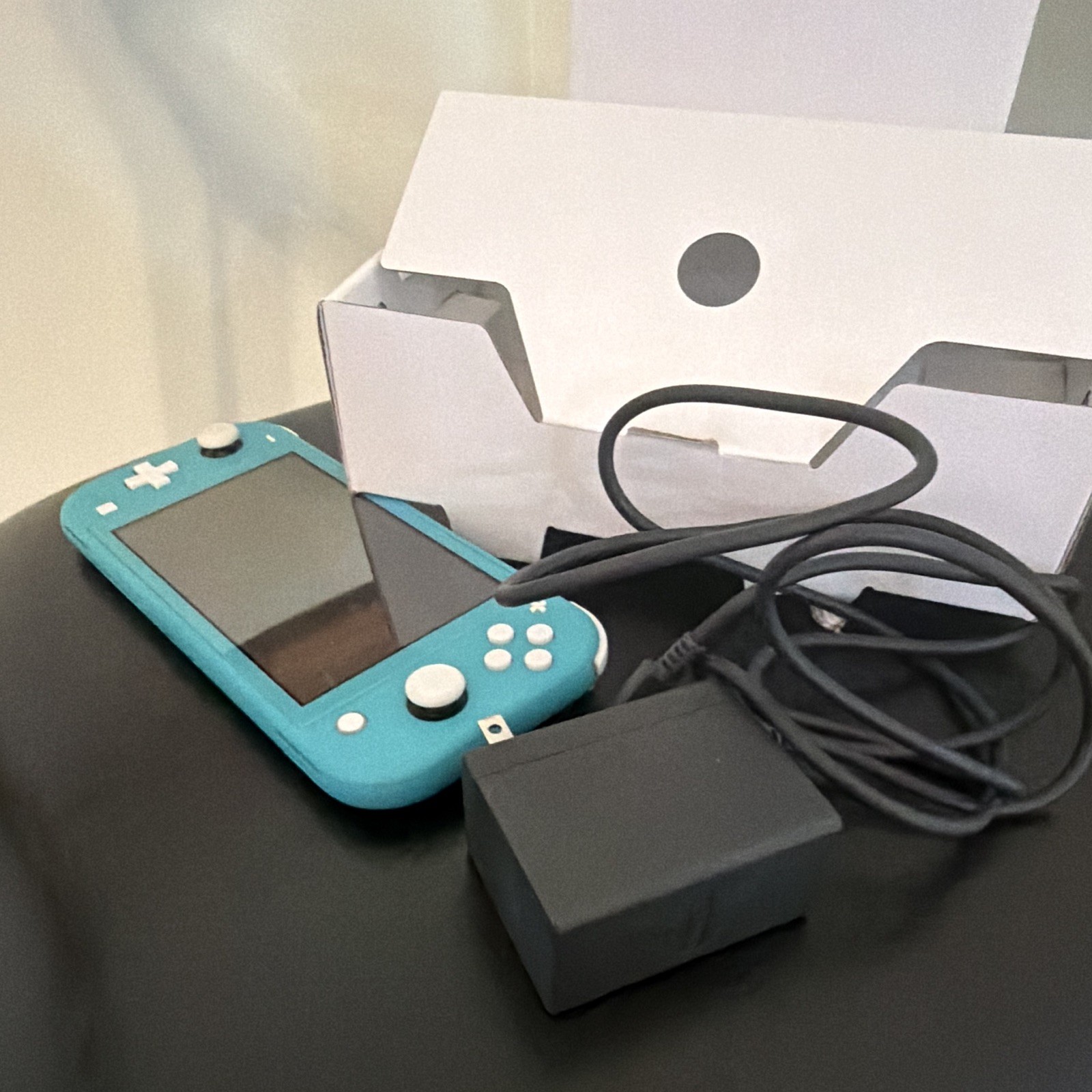 Nintendo lite handheld console w/ charger barely used owned for 1 month