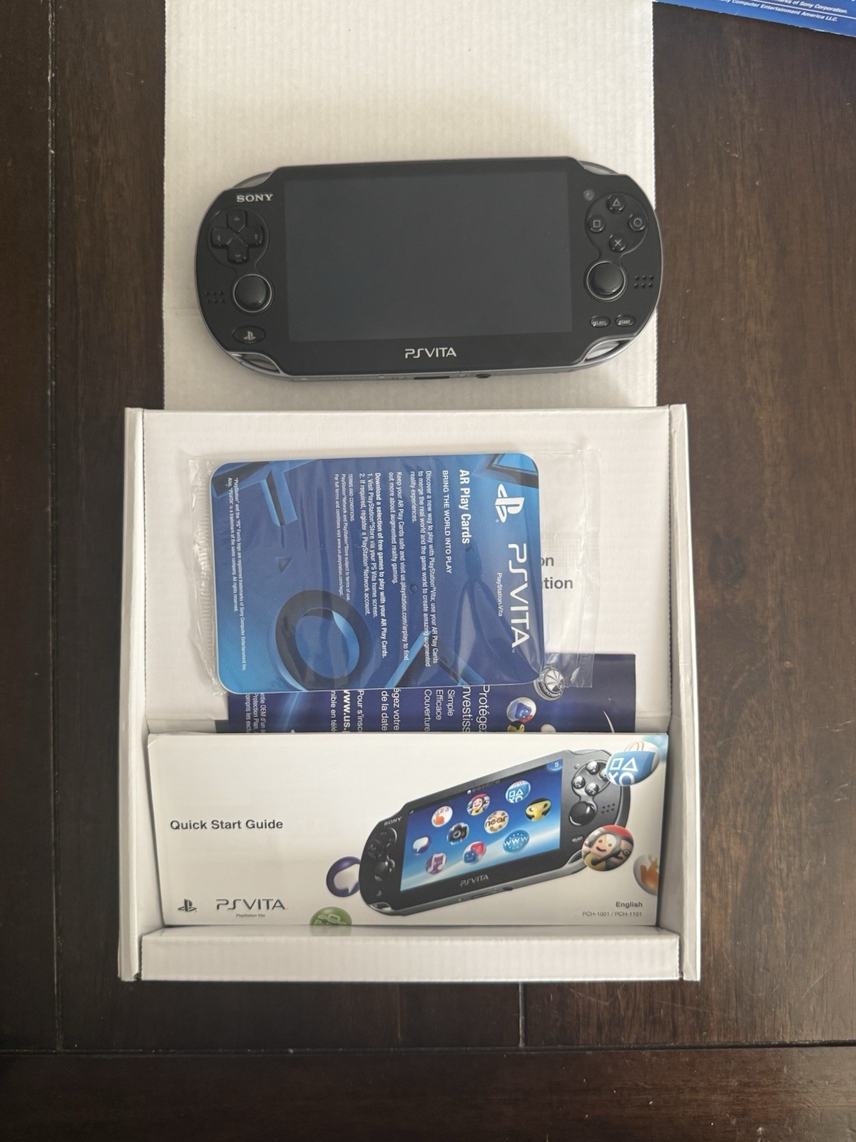 Sony PS Vita 1000, OLED Black Console w/ a box, Manuals, charger, sd2vita