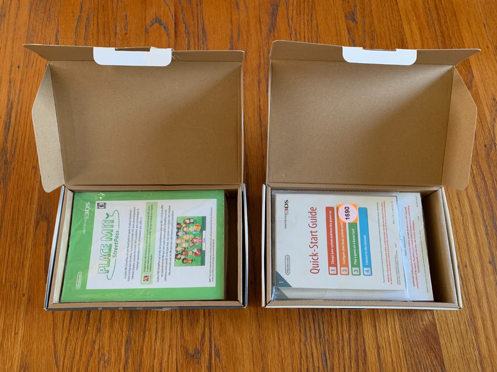 Lot of 2 Nintendo 3DS Cosmo Black and Flame Red console boxes and manuals only