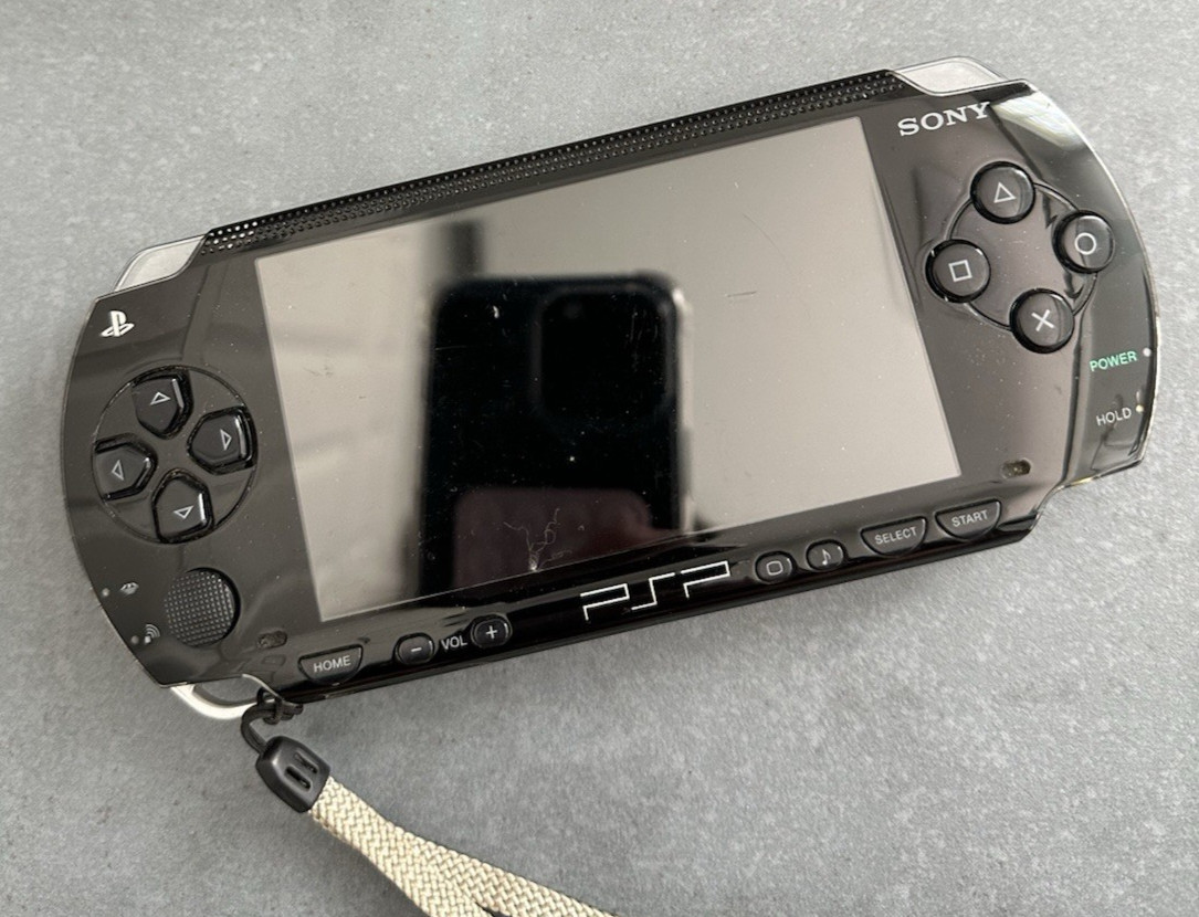 Sony PlayStation PSP-1001 Black PSP Portable Console + 6 Games + Charger + Case