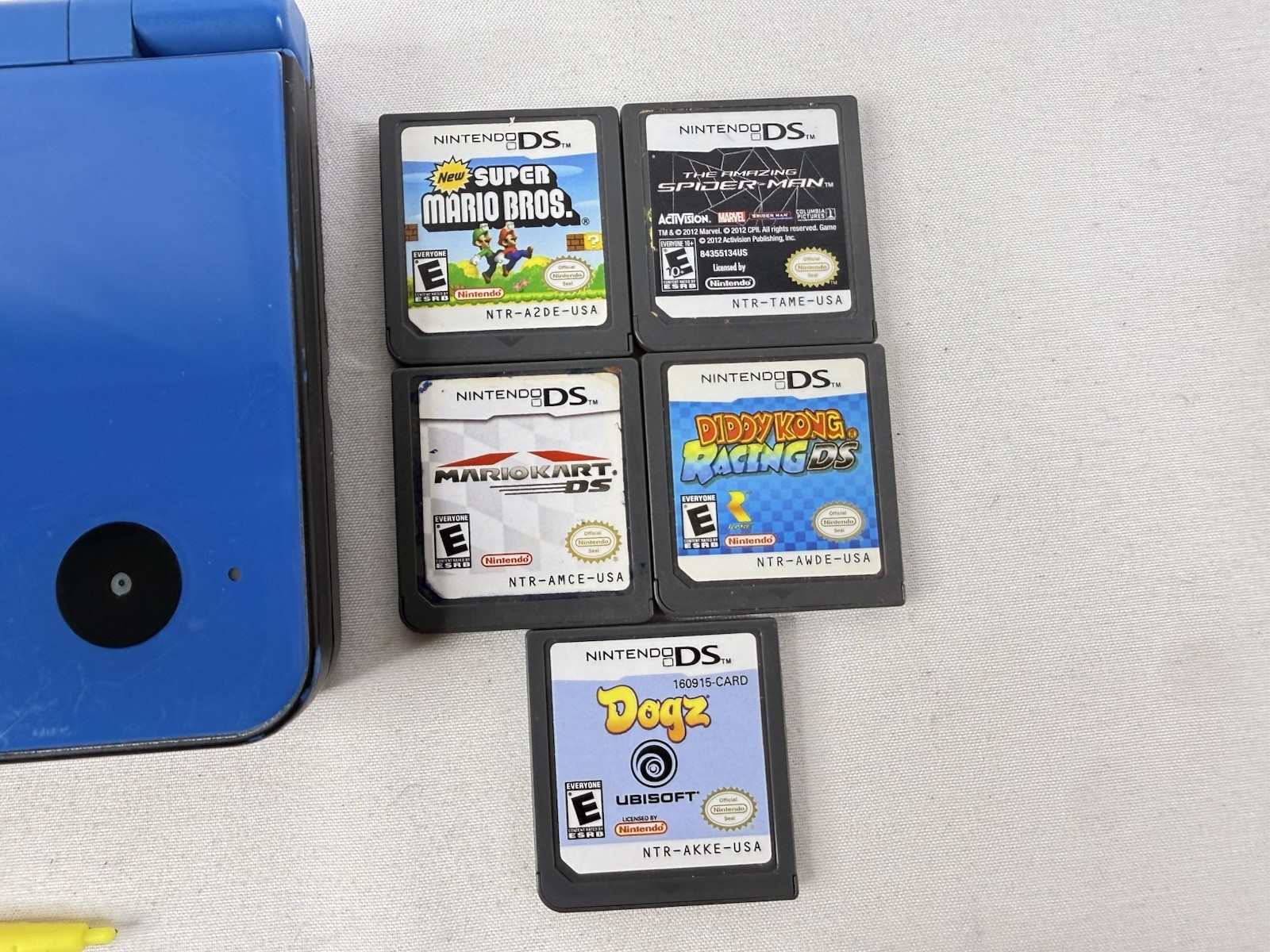 Nintendo DSi XL Handheld Game Console UTL-001 Midnight Blue, 5 Games & Charger