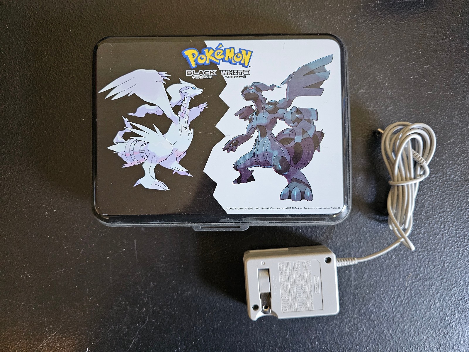 Nintendo DSi System Purple & Black w/ Charger & Pokemon Black & White Hard Case