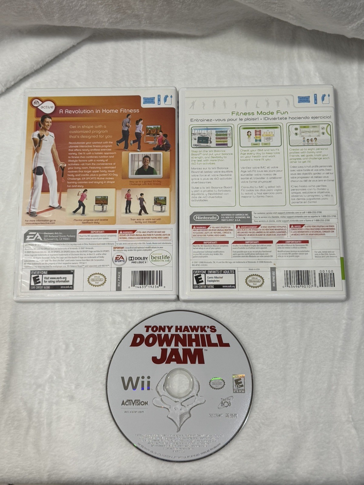 Nintendo Wii console with 2 remotes, 1 silicone sleeve & Nerf sports attachments