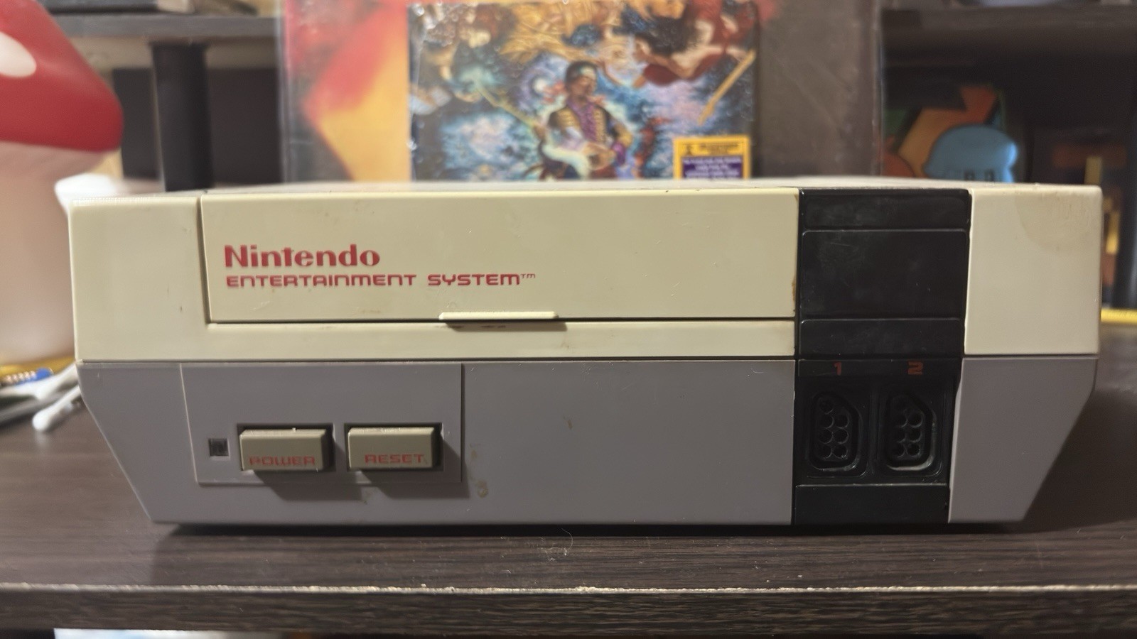 Nintendo entertainment System With Two Controller, Gun, And A Lot Of Games.