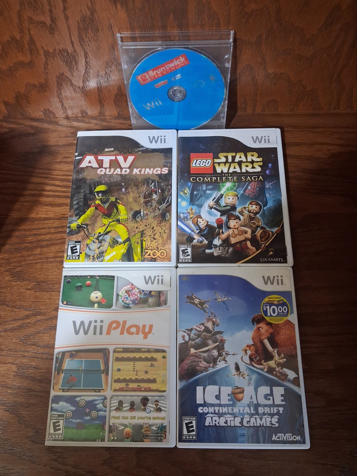 Nintendo Wii Game Lot: Ice Age, Wii Play, LEGO Star Wars, ATV Quad Kings & more.