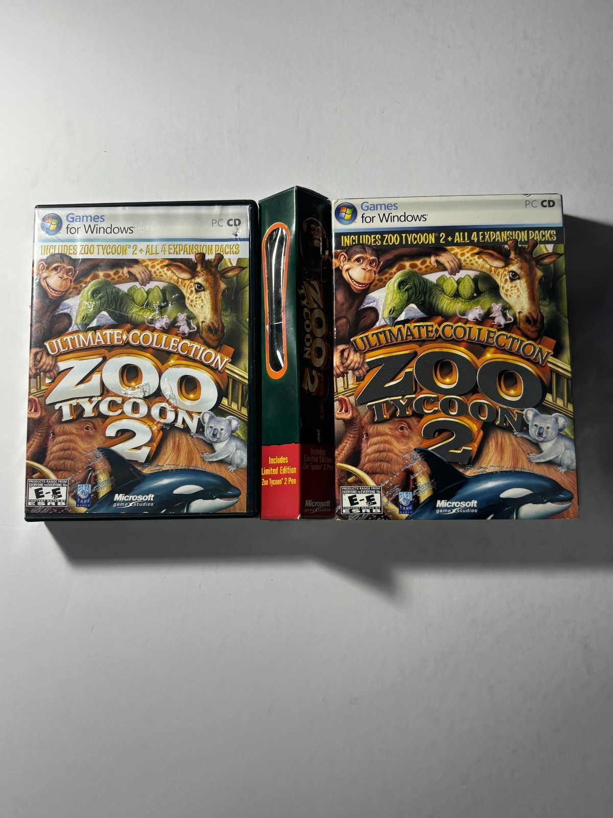 Lot of Zoo Tycoon games and pen