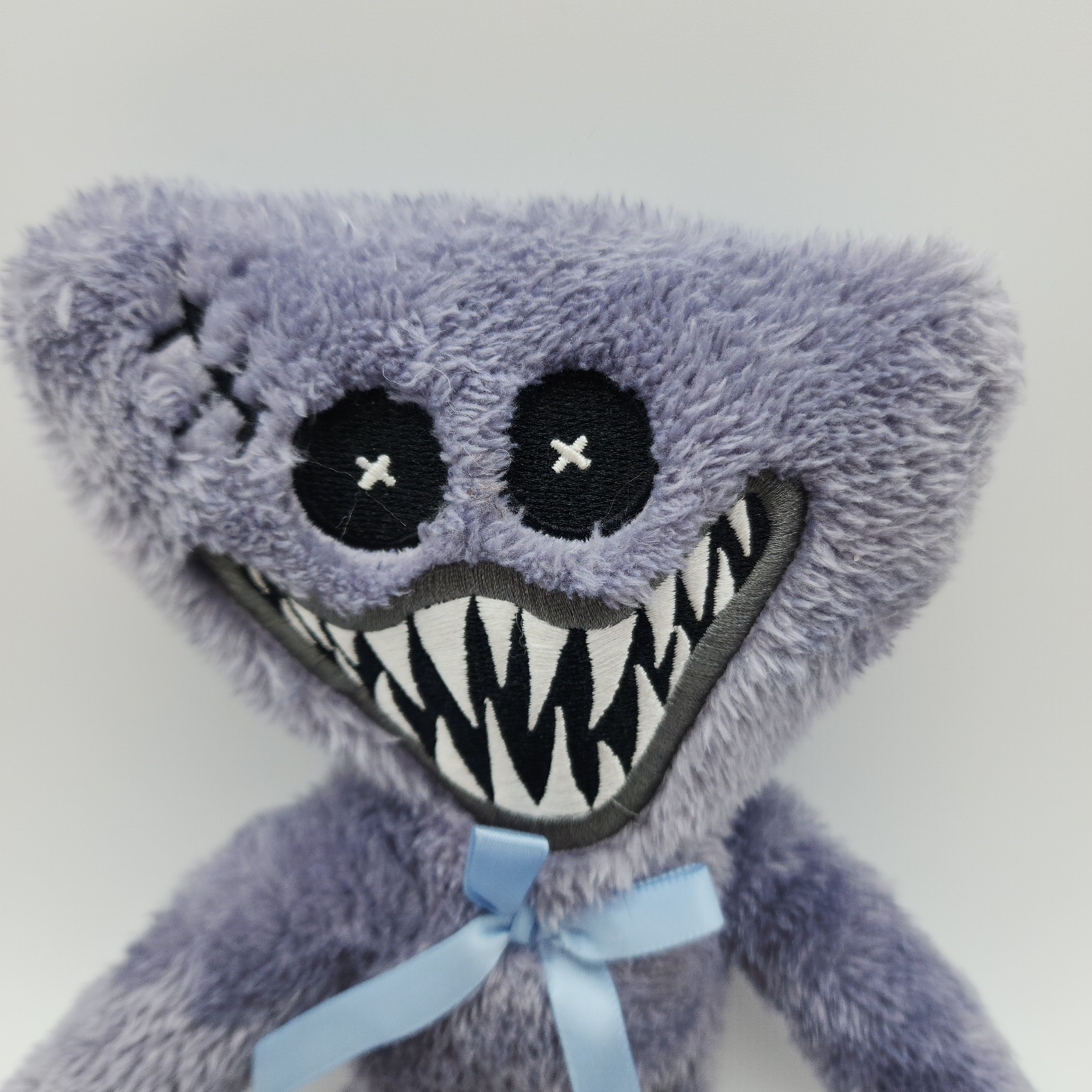 Official Poppy’s Playtime Grey Stitched Huggy Wuggy Plush Toy with Blue Bow