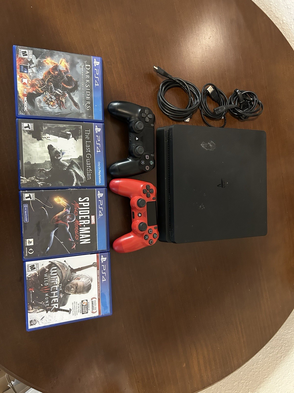 PS4 Slim 1TB Console W/ 2 Controllers, 4 Games