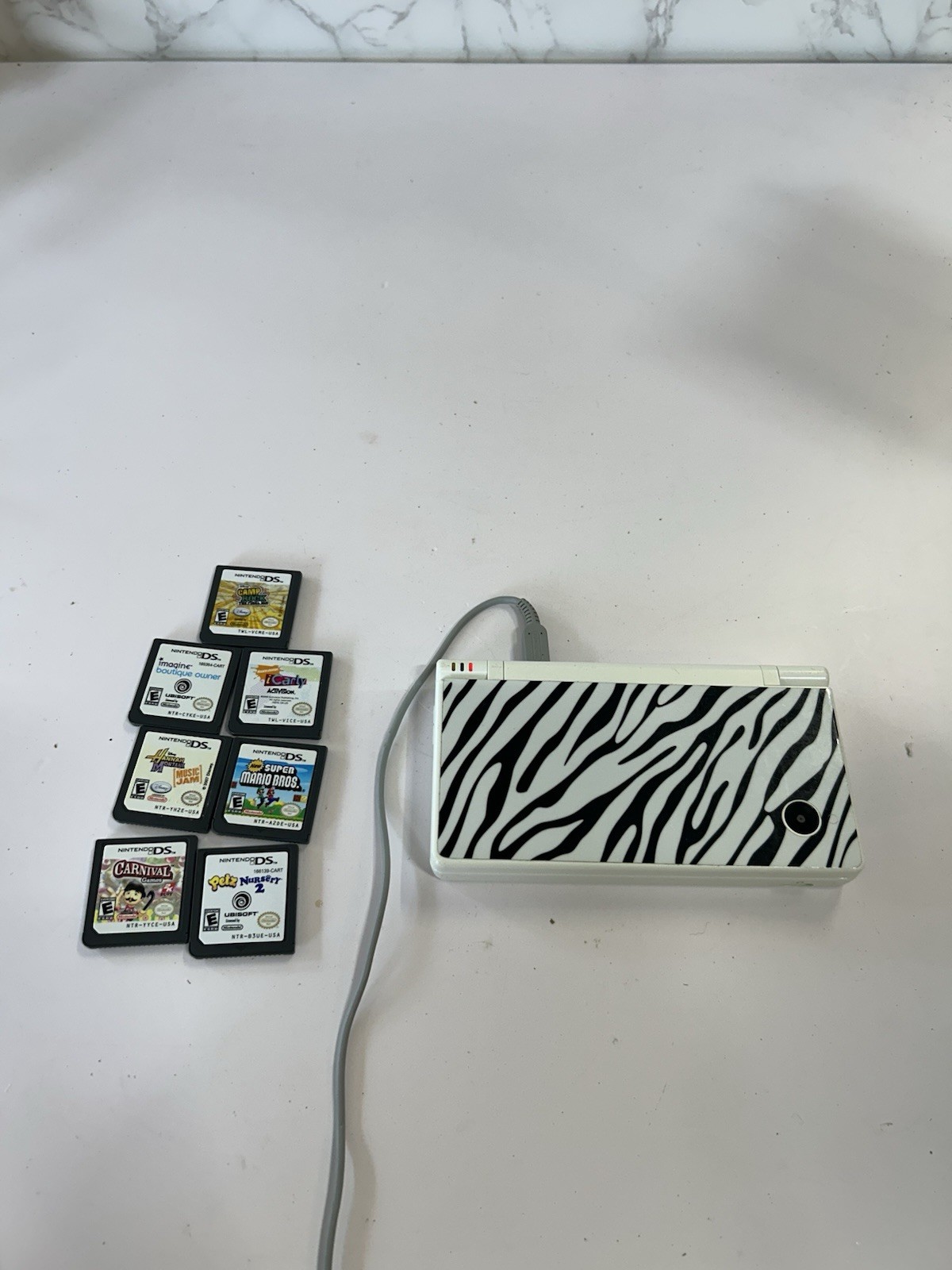 Nintendo DSi White With Print Cover Handheld System with 7 Games
