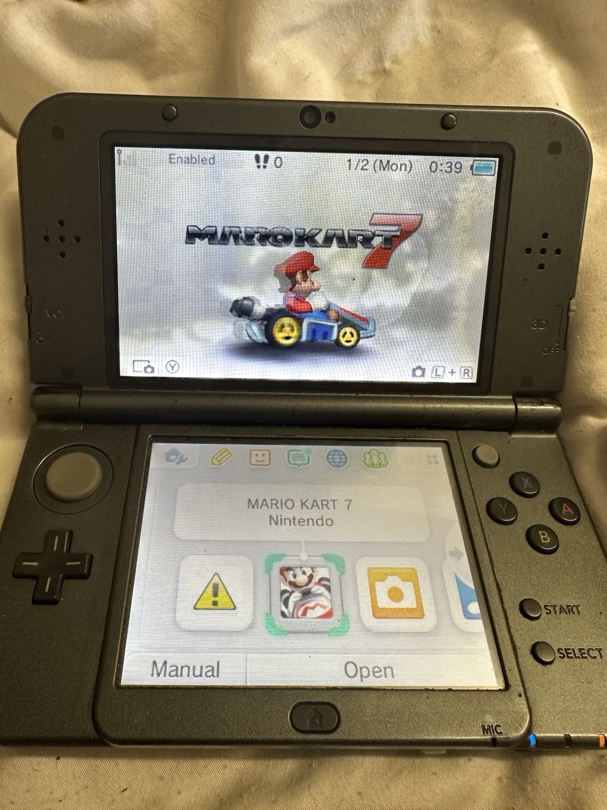 Nintendo “New”3DS XL Black System RED-001 W/ Charger , Mario Kart 7 & Carry Case