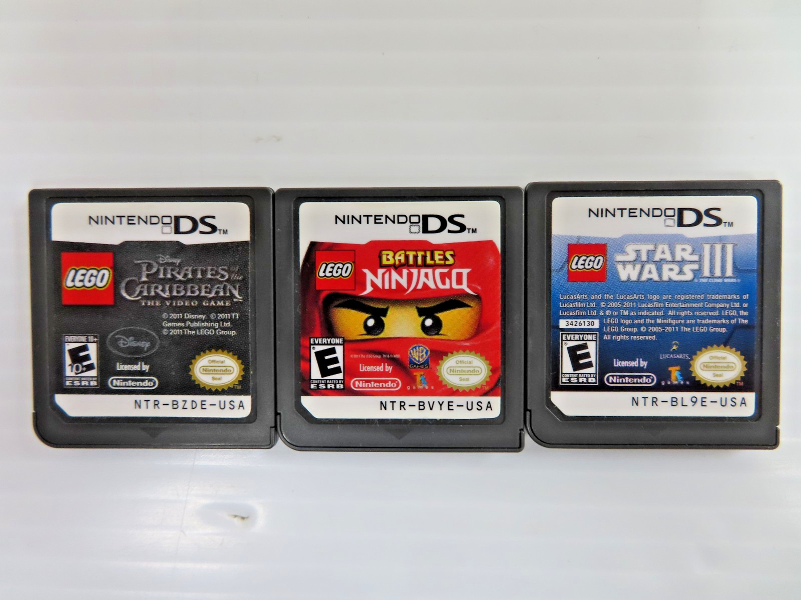 LOT OF 3 LEGO PIRATES/NINJAGO/STAR WARS NINTENDO DS TESTED WORKS VIDEO GAME