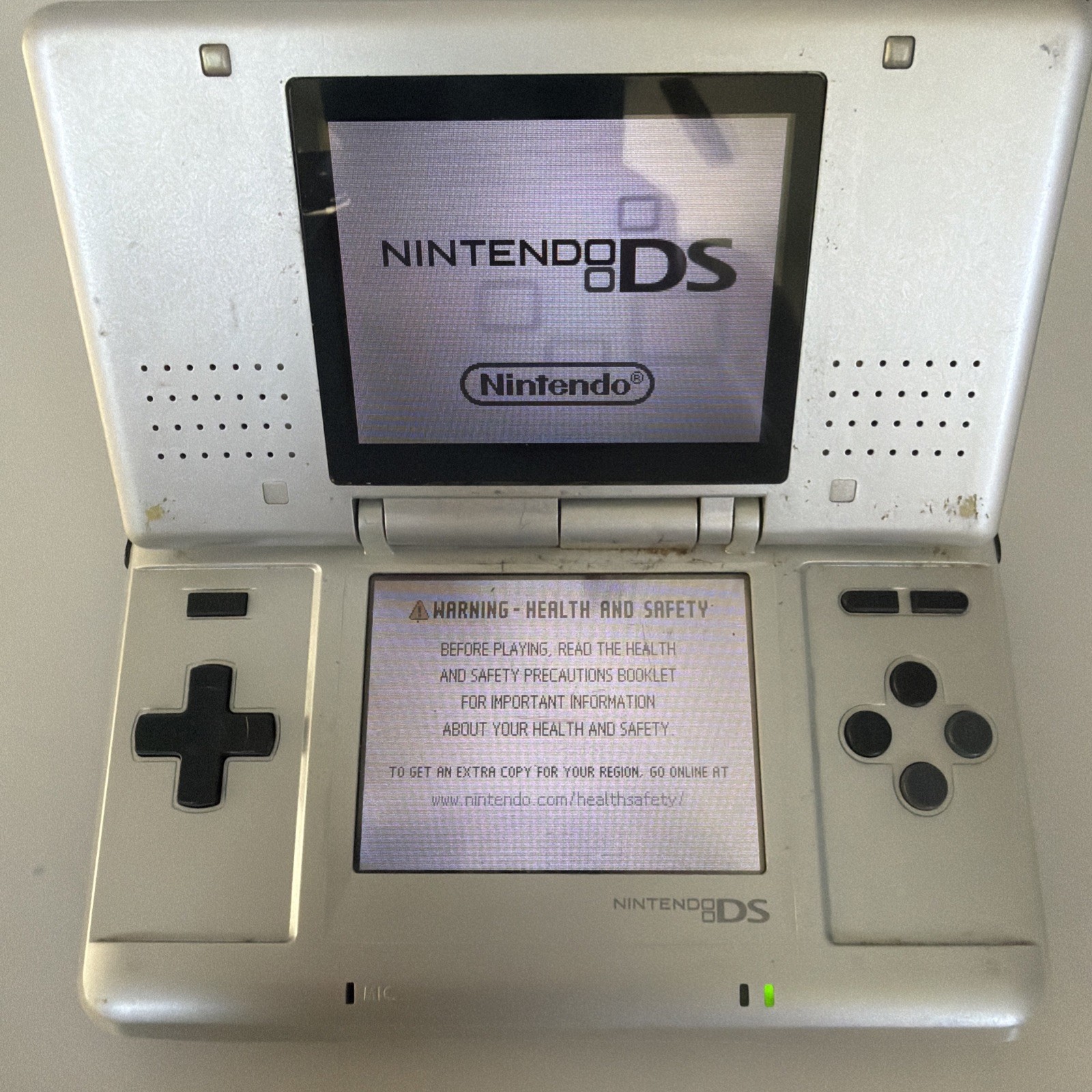 Nintendo DS Silver Handheld System – Fair Condition – TESTED AND WORKING W/ Game