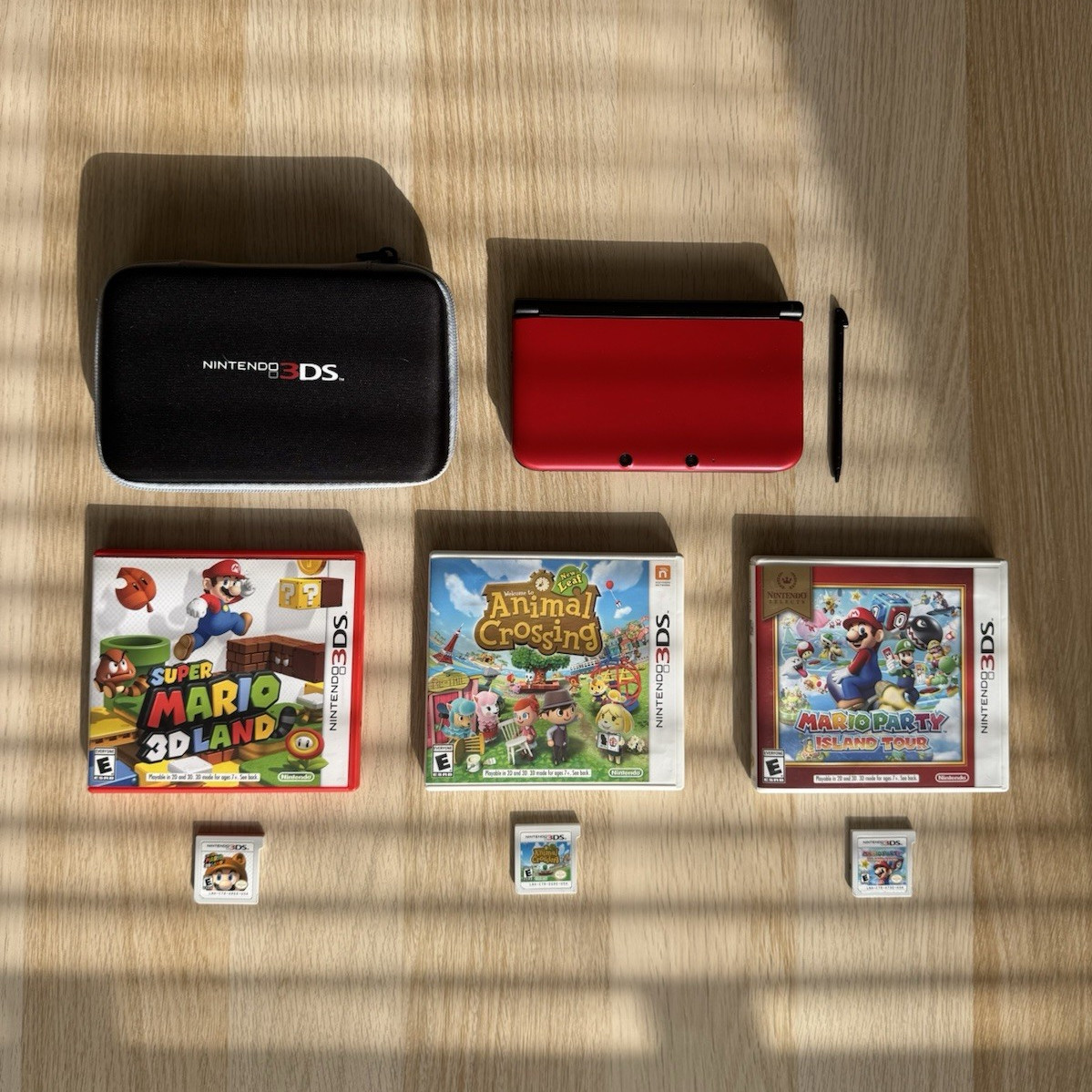 Nintendo 3DS XL Red/Black – Includes Stylus, Case + 3 Games