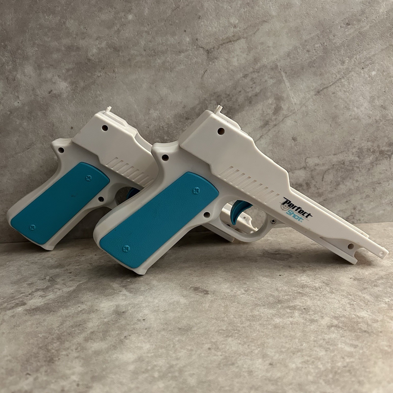 Nyko Perfect Shot Gun Controller White Blue Orange for Nintendo Wii Remote Pair
