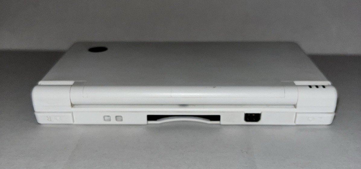 Nintendo DSi Handheld Game Console + Charger & Stylus White tested