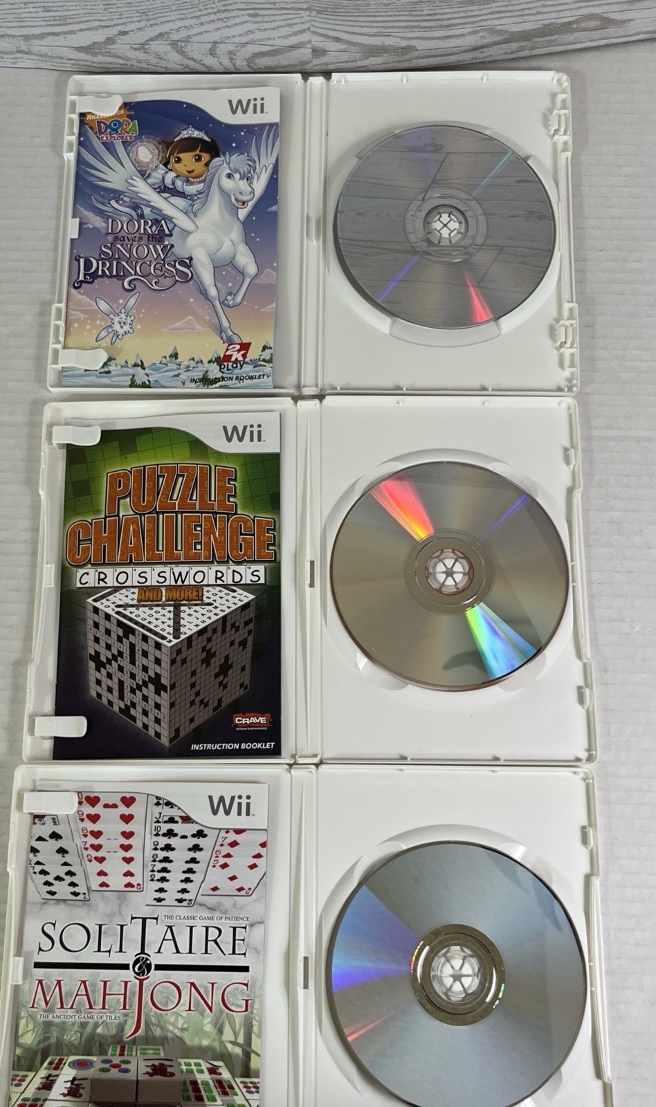 Lot of 8 Nintendo Wii Games Barbie Dora Wii Fit Plus Puzzle Deal or No Deal.