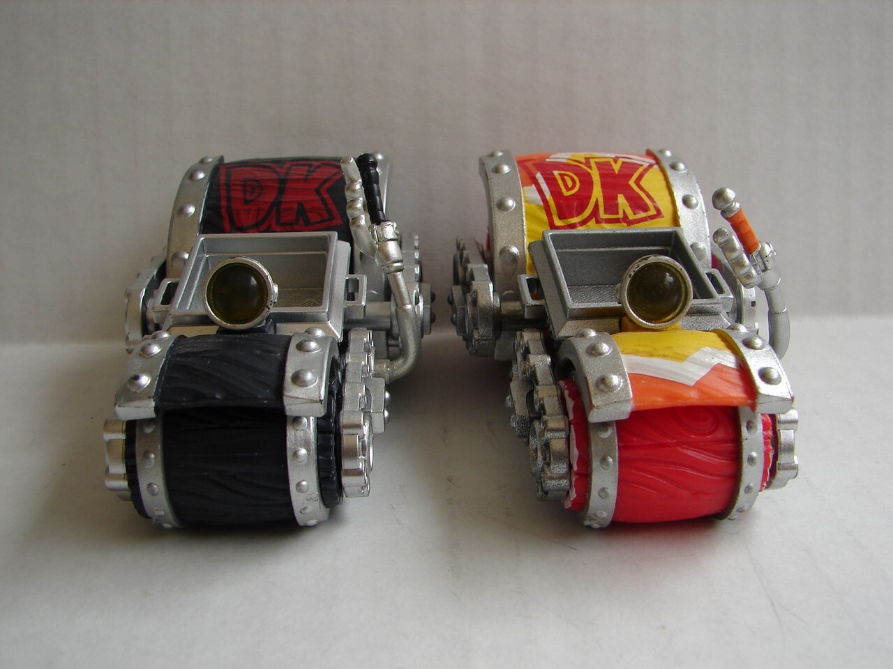 two different Skylanders: SuperChargers: Dark Barrel Blaster and yellow