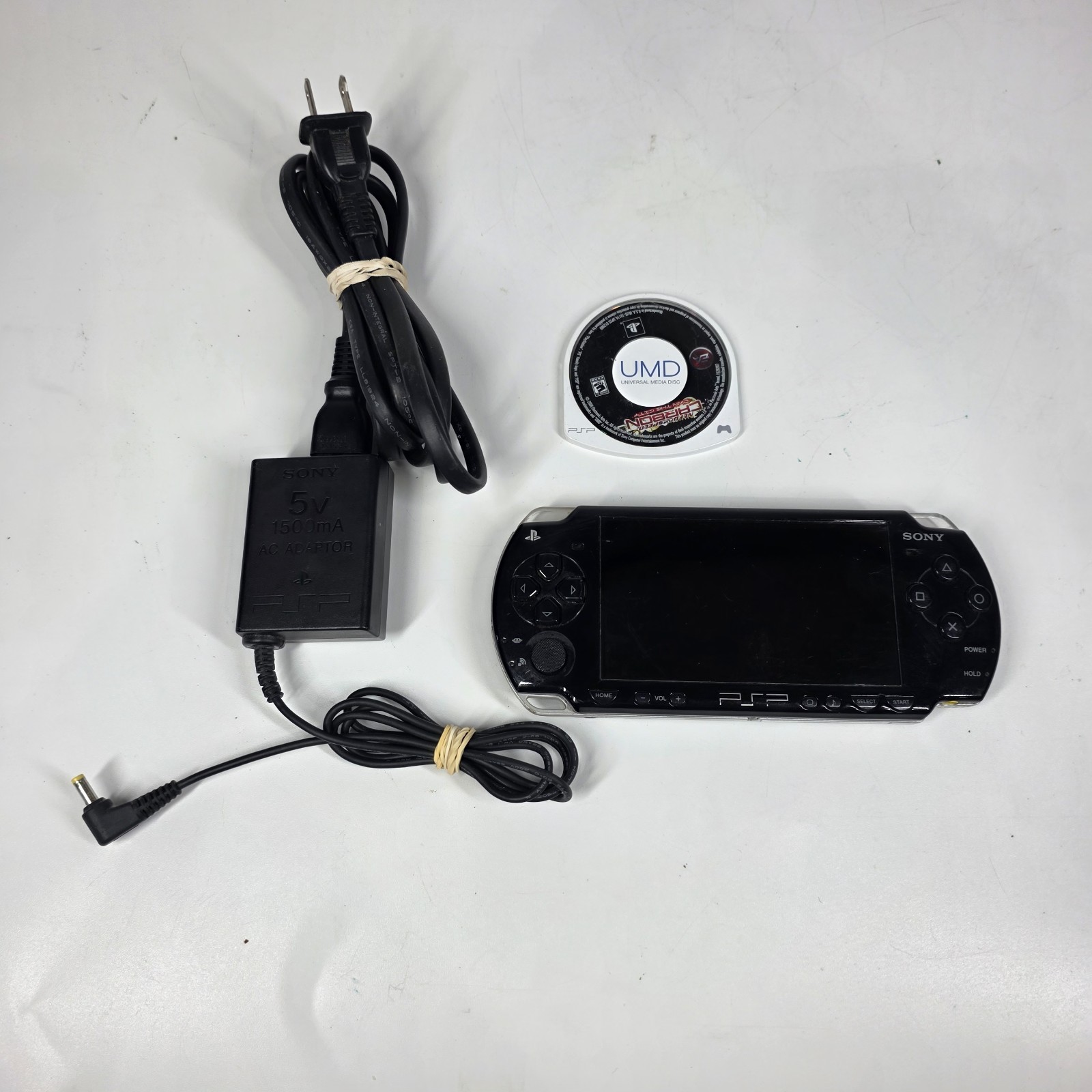 Sony PSP-2001 Slim Edition Black w/ Charger & Need For Speed Carbon – No Battery