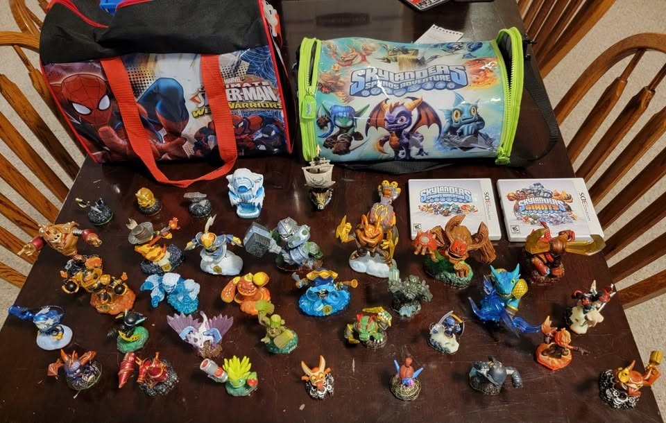 Skylanders collection of figures, 3DS games, items, vehicles, and carrying bags
