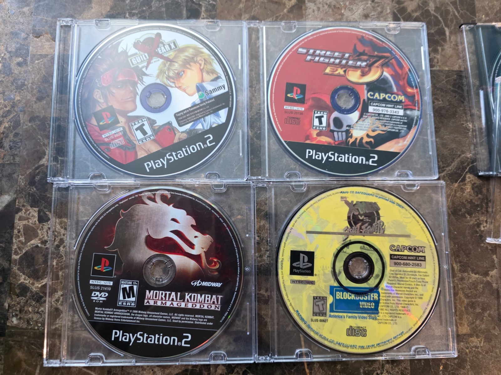 PS2 Slim Console + 13 games+Guncon+ SF Controller + Xmen vs Street Fighter etc.