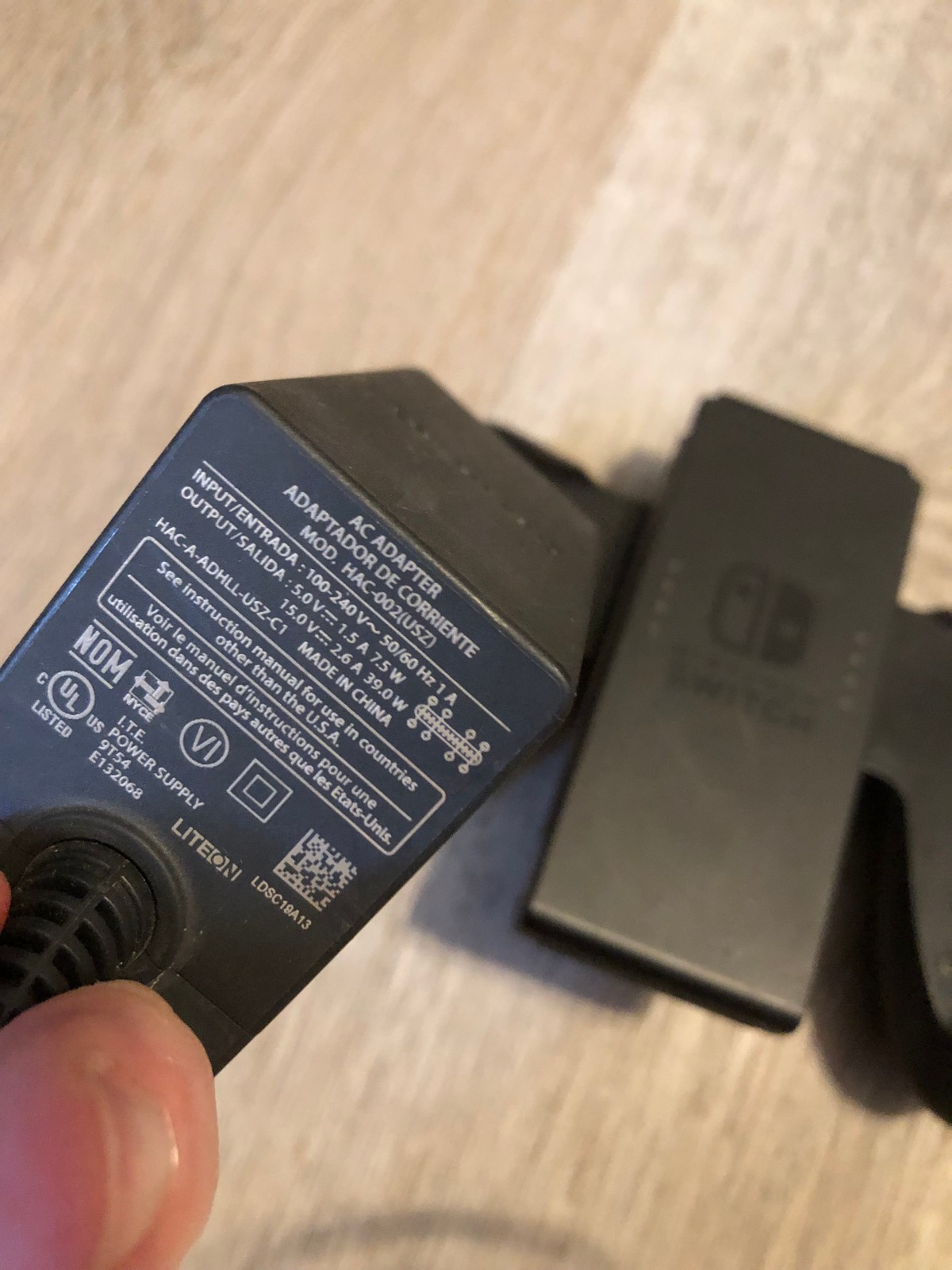 Nintendo Switch AC Adapter Model HAC-002(USZ). Tested with bonus grip HAC-011