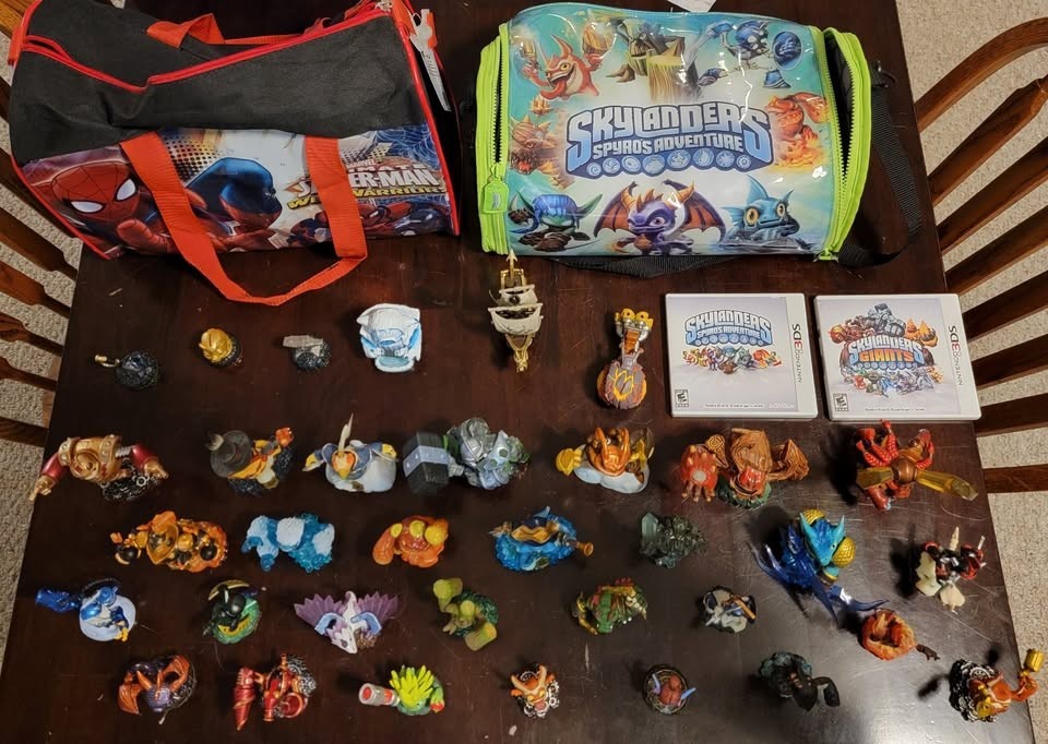Skylanders collection of figures, 3DS games, items, vehicles, and carrying bags