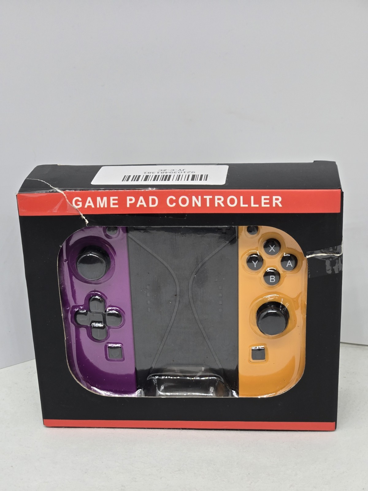 New game pad controller set with one purple and one orange controller. This set