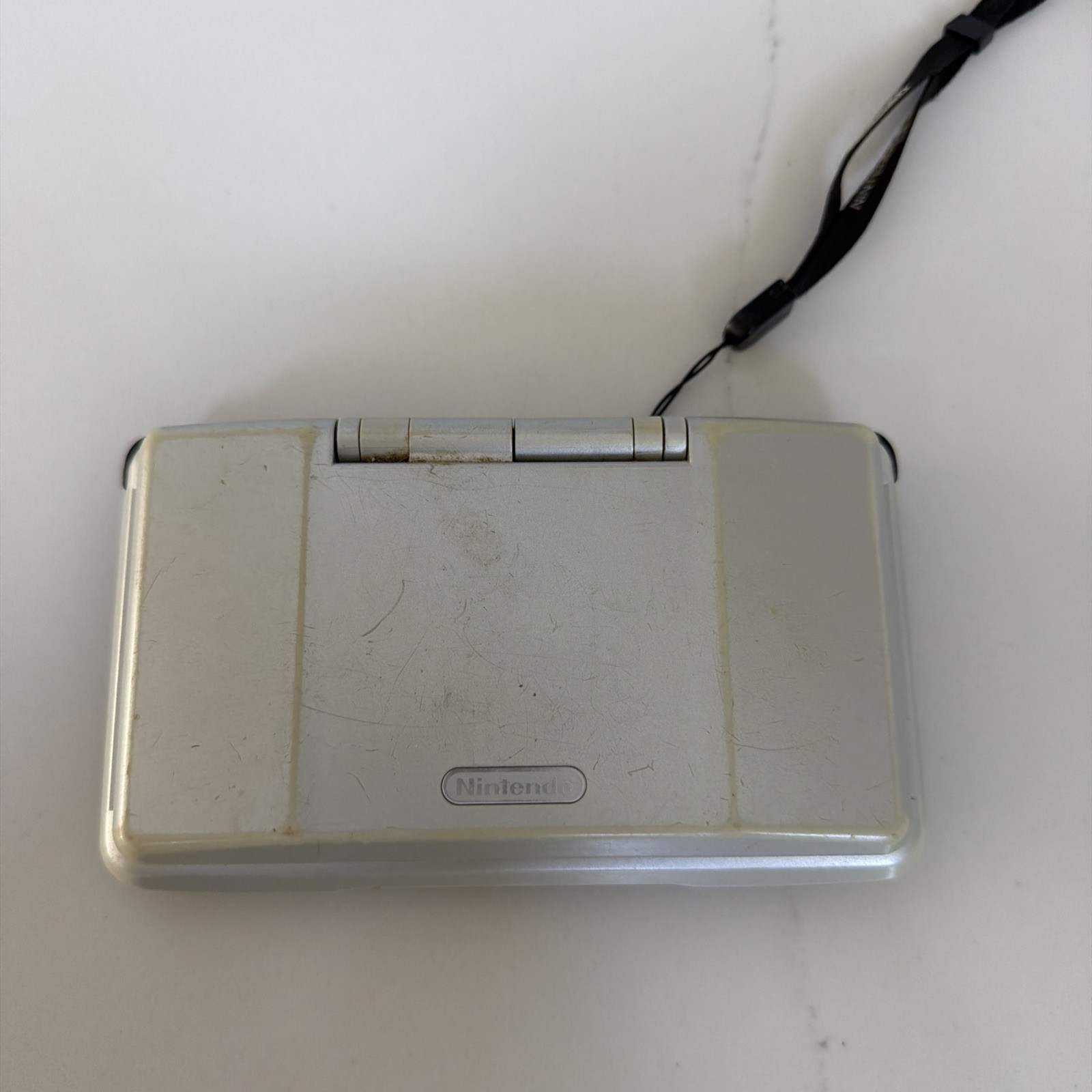 Nintendo DS Silver Handheld System – Fair Condition – TESTED AND WORKING W/ Game