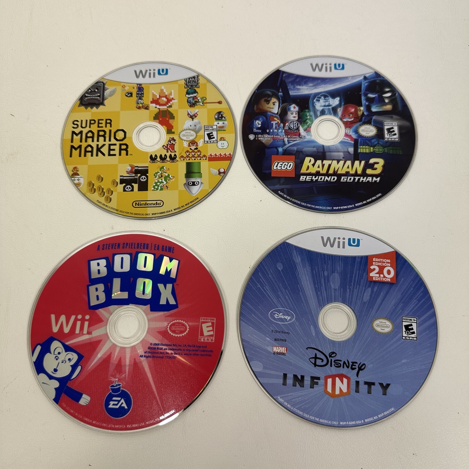 Wiiu Wii lot of 4 games Mario Maker Lego Batman Boom Blox Disney Infinity
