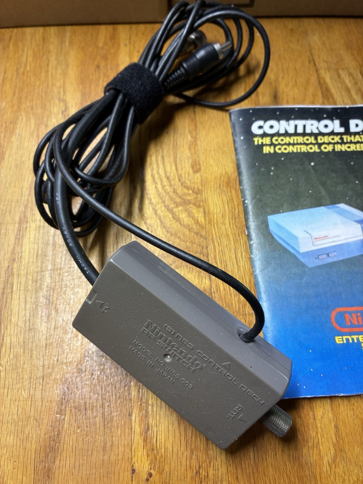 2 Vintage Nintendo NES OEM Controllers, RF Adapter, And Manual.