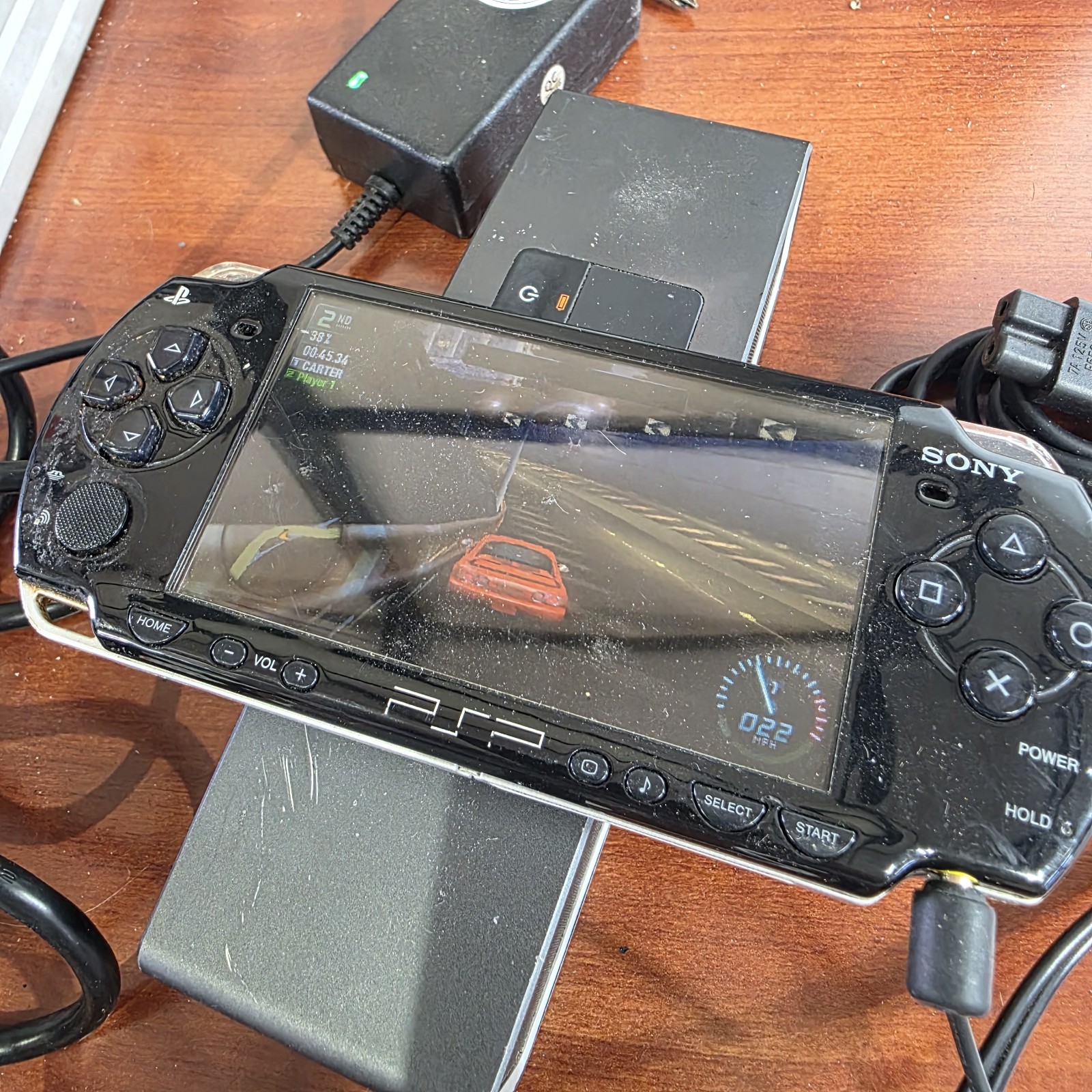 Sony PSP-2001 Slim Edition Black w/ Charger & Need For Speed Carbon – No Battery
