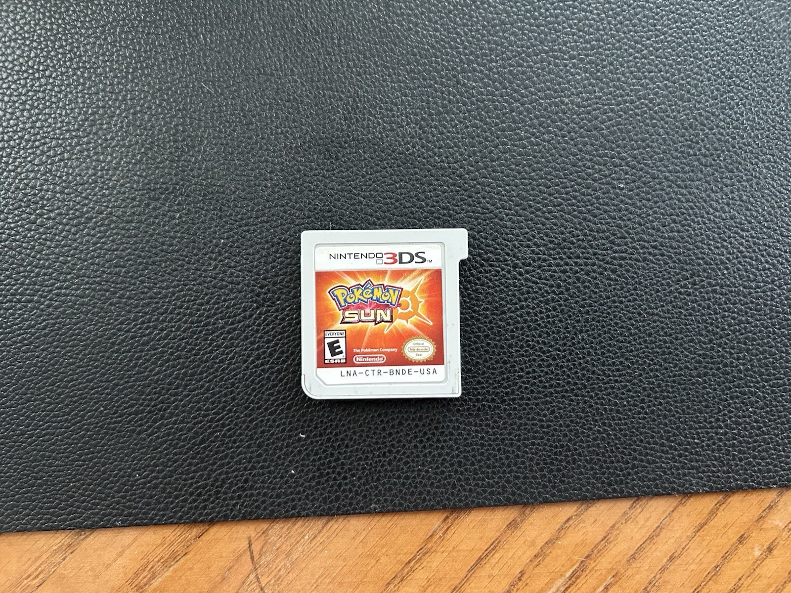 Nintendo 3DS XL Red/Black Console w/ AC Adapter + Pokémon Sun Game NTSC-U/C