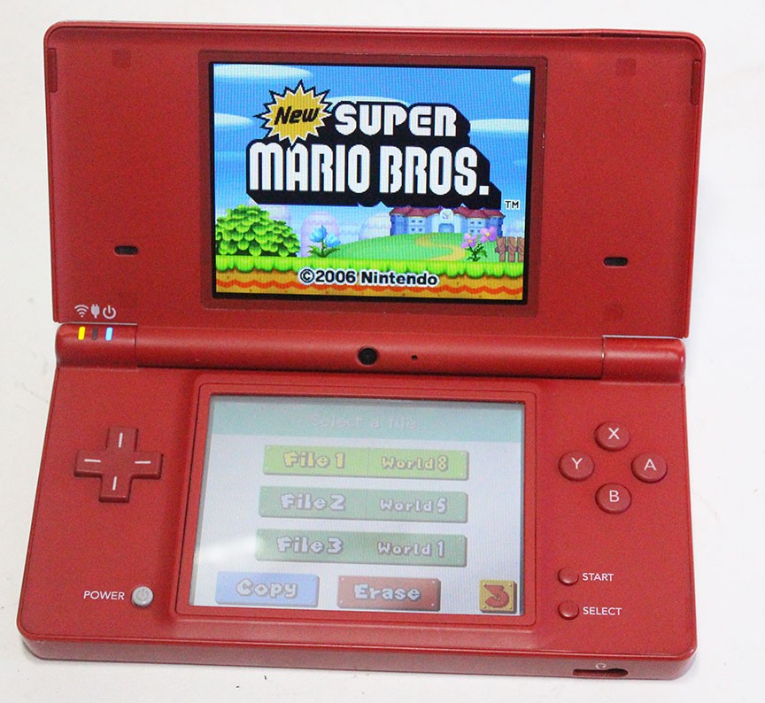 Nintendo DSi Red Handheld Game Console w/ Mario Skin Cover + Super Mario DS Game