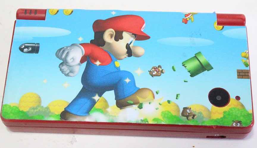 Nintendo DSi Red Handheld Game Console w/ Mario Skin Cover + Super Mario DS Game