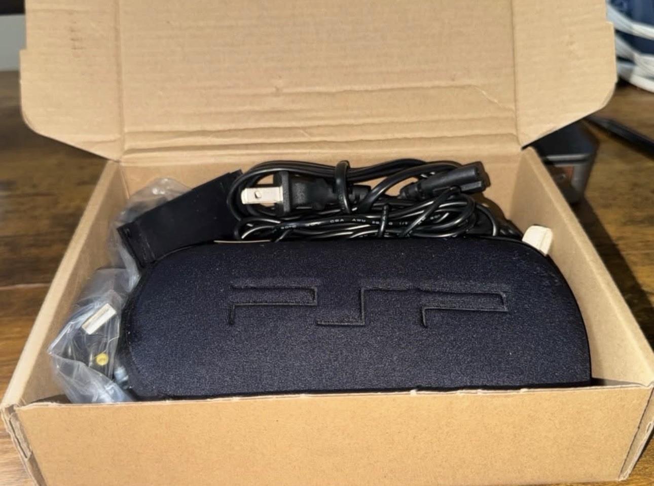 Sony PSP-1000 Black Handheld System Bundle w/ Case, Charger, UMD Compatible