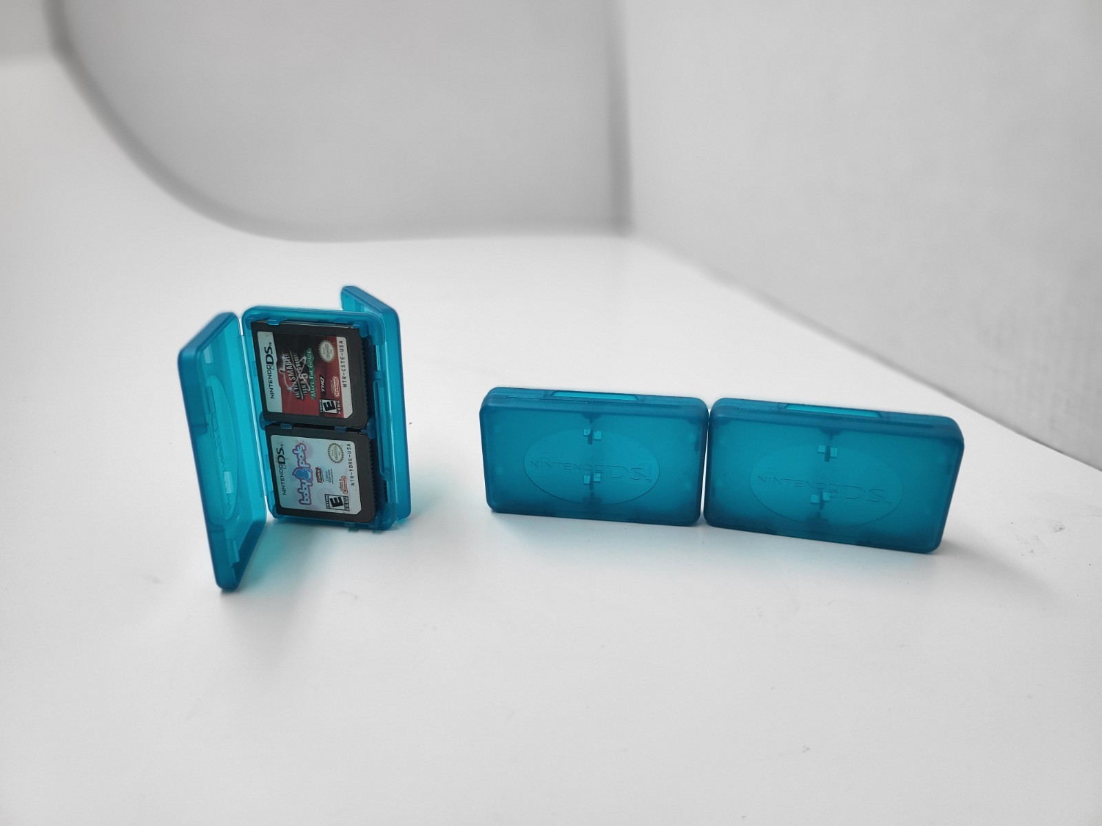 3 NEW OFFICIAL NINTENDO DS CLEAR BLUE 4 GAME CARTRIDGE CASE HOLDER 12 TOTAL #G5