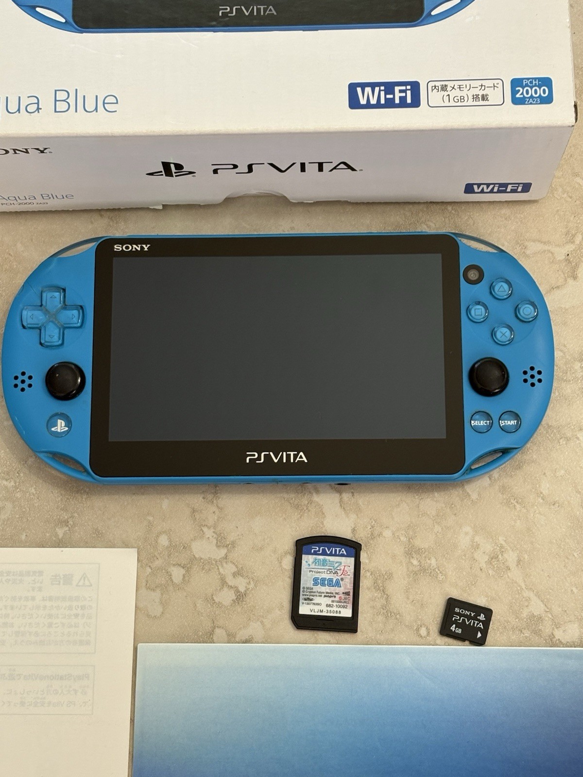 Sony PS Vita PCH-2000 Complete In Box – Aqua Blue 4GB Very Good Condition