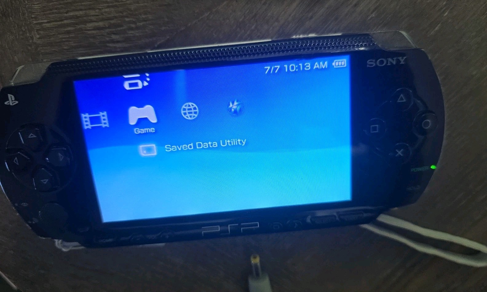 Sony PSP-1001 Black Handheld System, Charger, Memory Cards, And Cases. Read !!