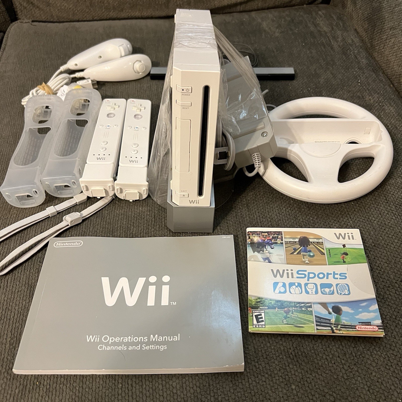 Nintendo Wii Console Bundle w/ Wii Sports, 2 Remotes, Nunchuks, Wheel & Manuals