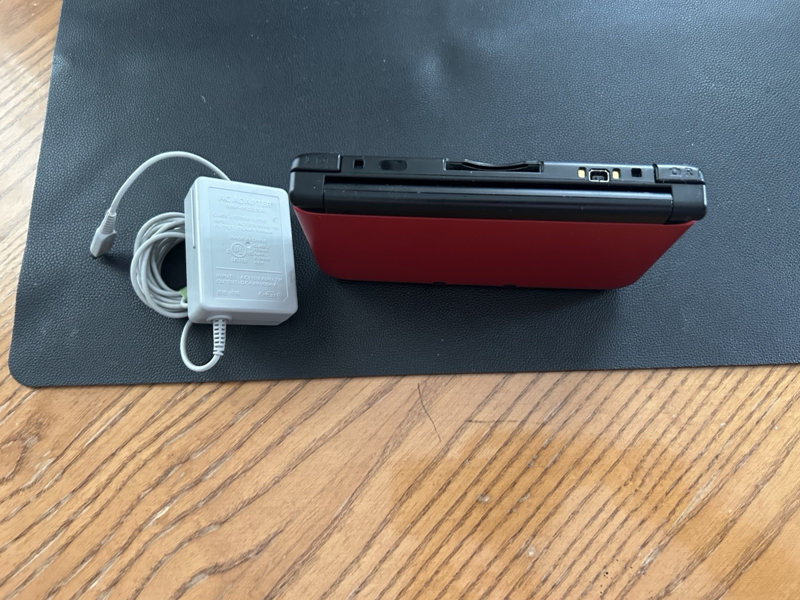 Nintendo 3DS XL Red/Black Console w/ AC Adapter + Pokémon Sun Game NTSC-U/C
