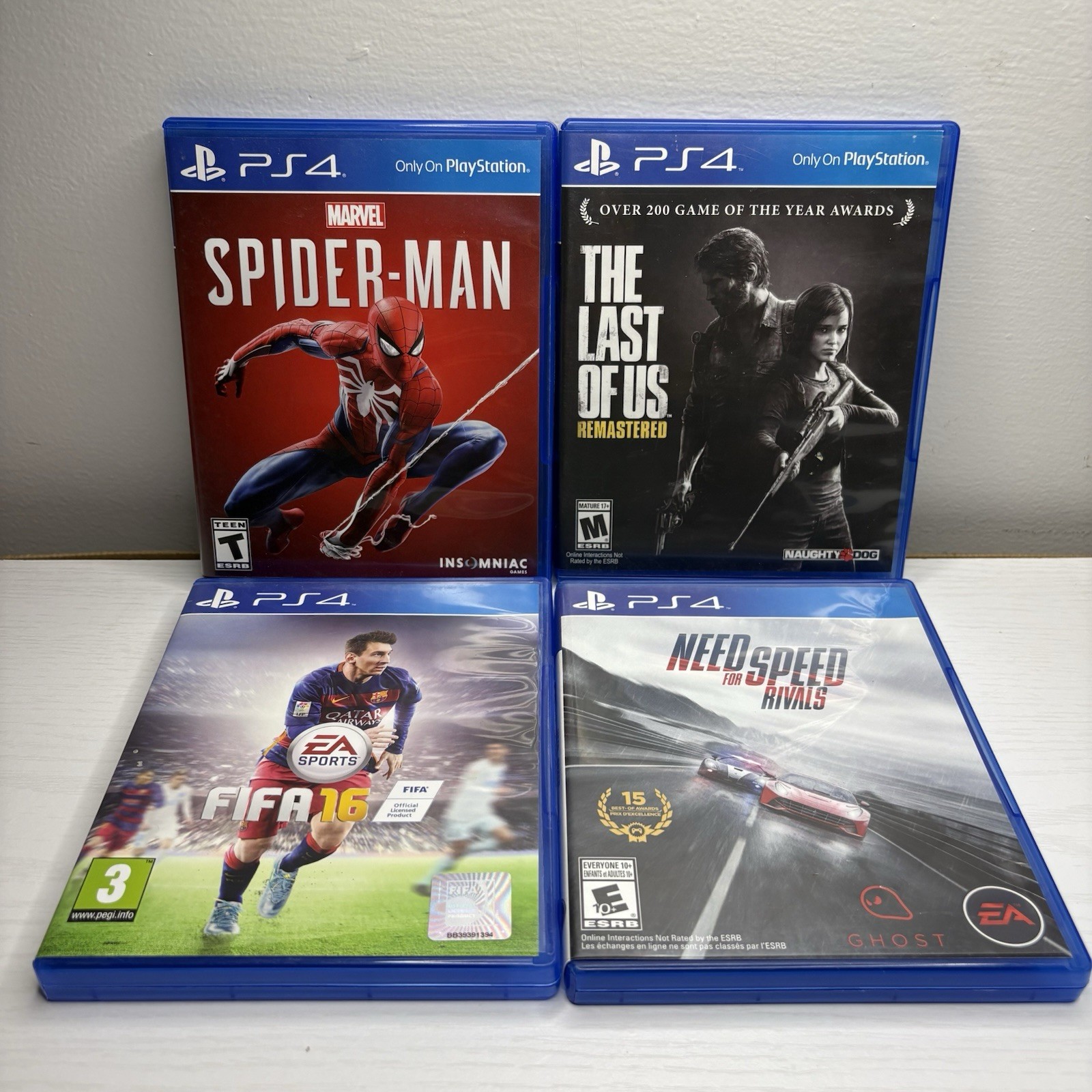 S4 Game Lot 4 – Spider-Man Last of Us Remastered NFS Rivals FIFA 16 CIB