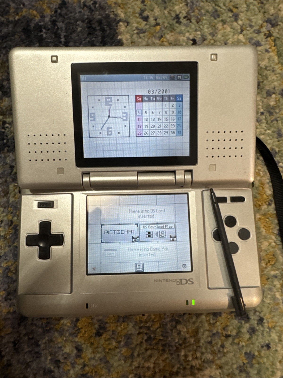 Nintendo DS Handheld System Silver with original wrist strap, stylus and charger