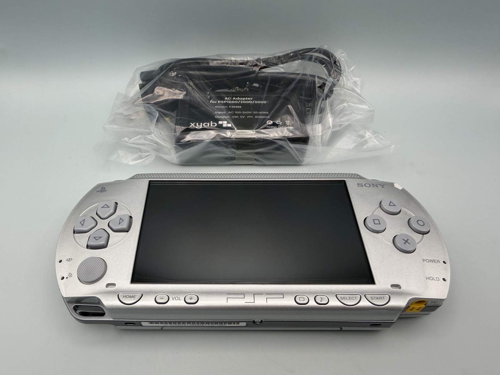 Sony PSP 1000 Silver Handheld Console – Tested Working + New Battery & Charger