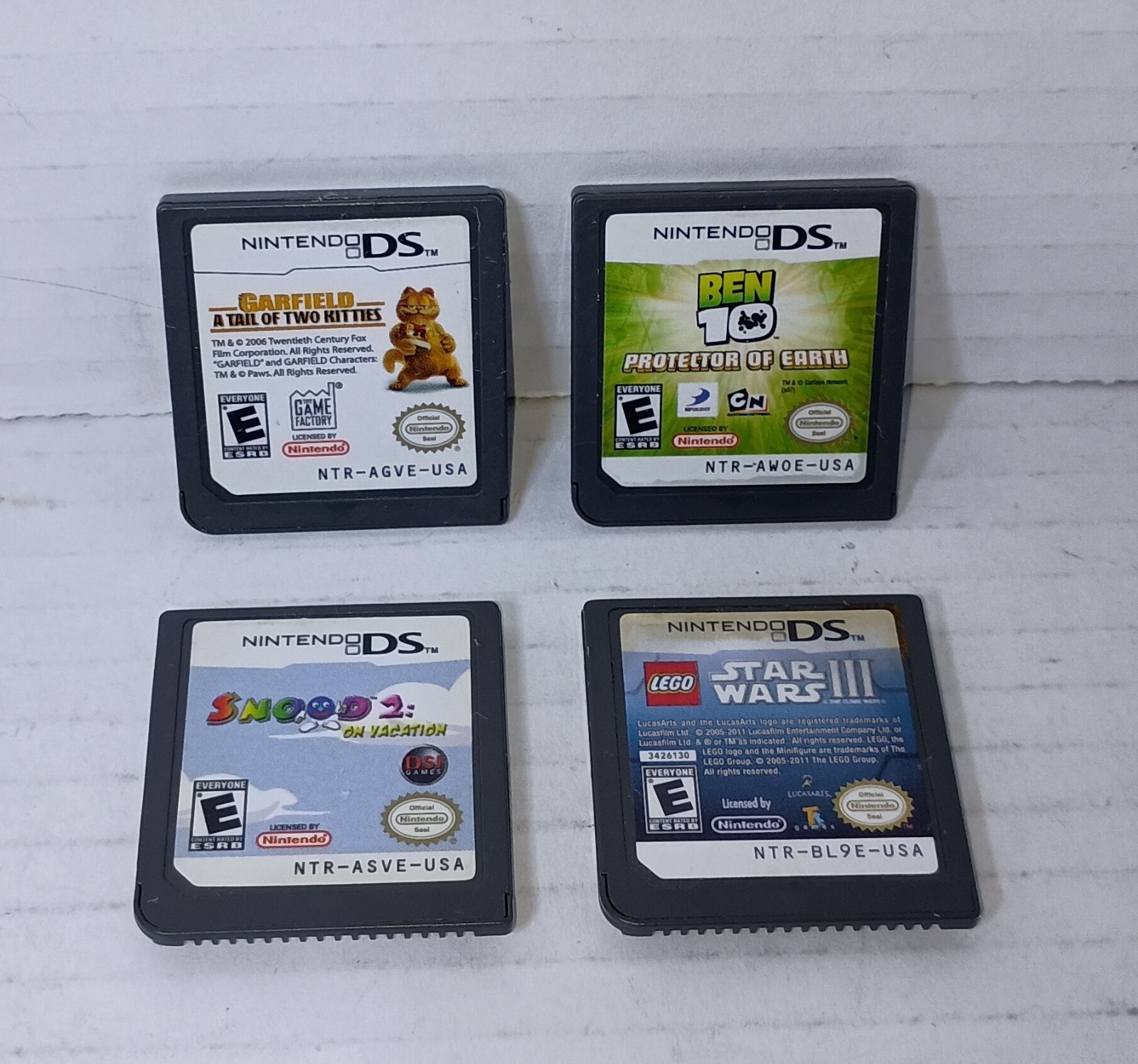 Nintendo DS Lot of 4 Ben 10 Garfield Snood 2 Star Wars CARTRIDGE Only Bundle