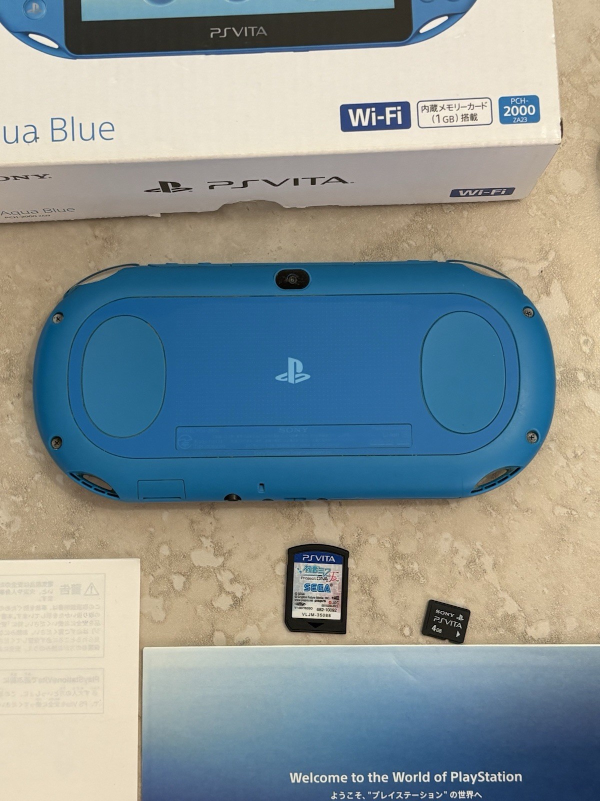 Sony PS Vita PCH-2000 Complete In Box – Aqua Blue 4GB Very Good Condition