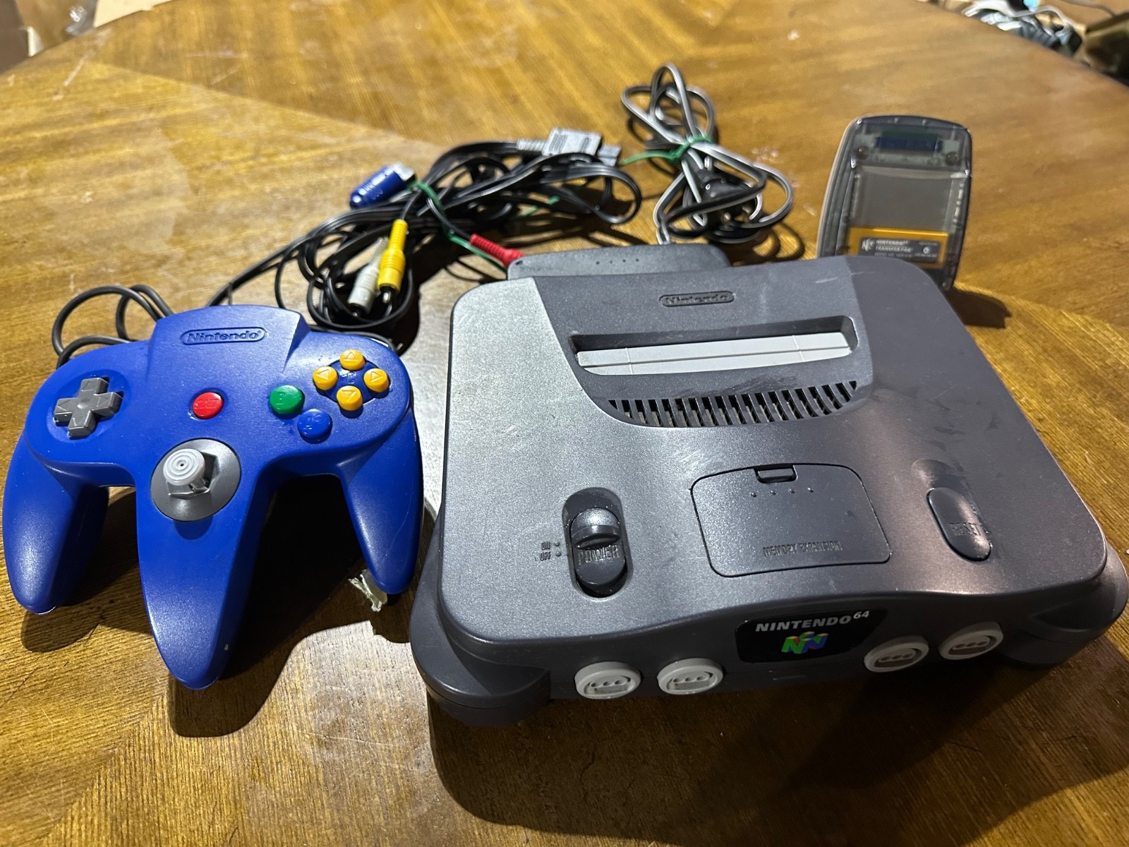 Nintendo 64 Home Console – Black With Cords, Blue Controller, and Transfer Pack
