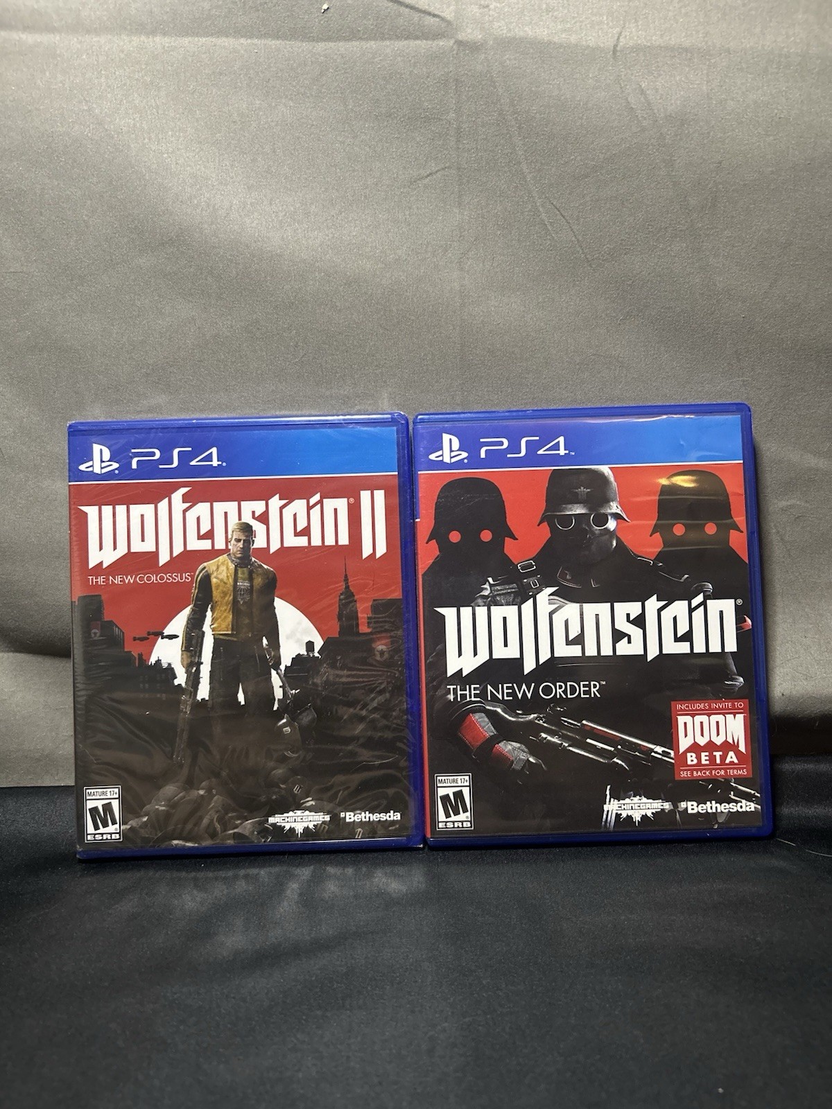 Wolfenstein Videogame Bundle – The New Colossus (sealed) & The New World Order